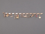 A gold bracelet decorated with eleven charms