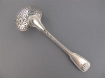 A silver sugar spoon