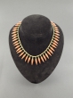 A gold and coral necklace